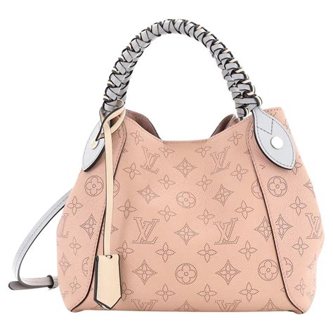 louis vuitton braided handle handbag.